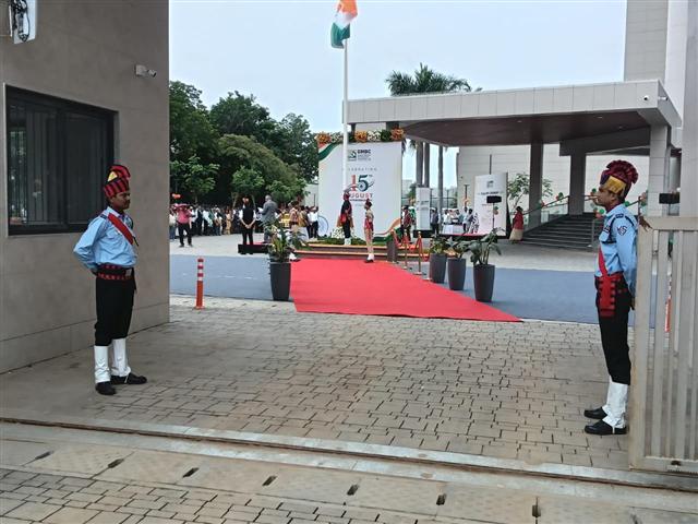 Guards flanking the flag-hoisting